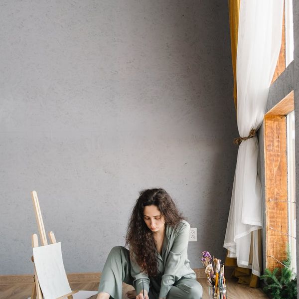 Woman meditating peacefully with a gentle smile, feeling energized.